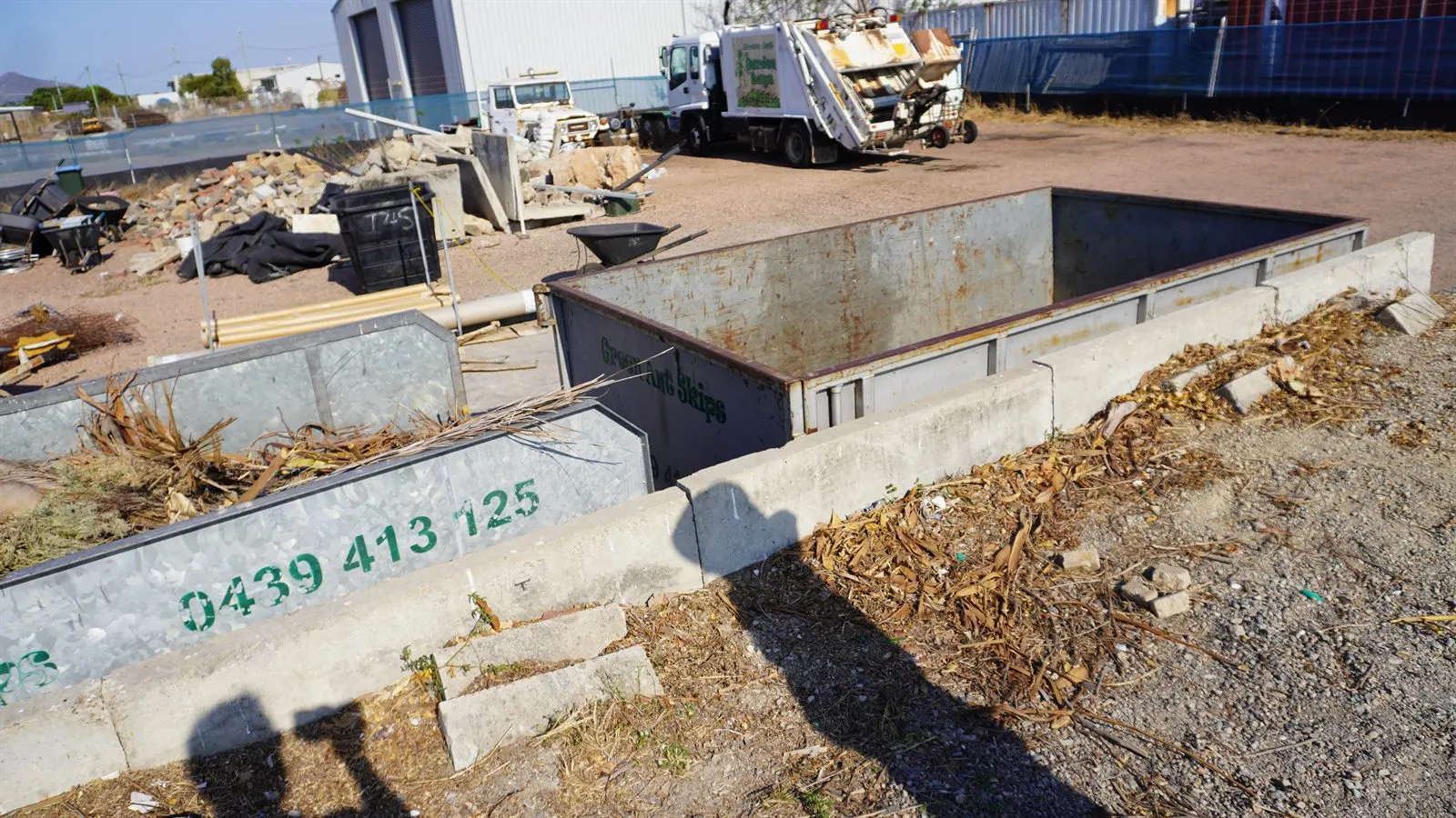 Green waste skip bin on the job in Townsville