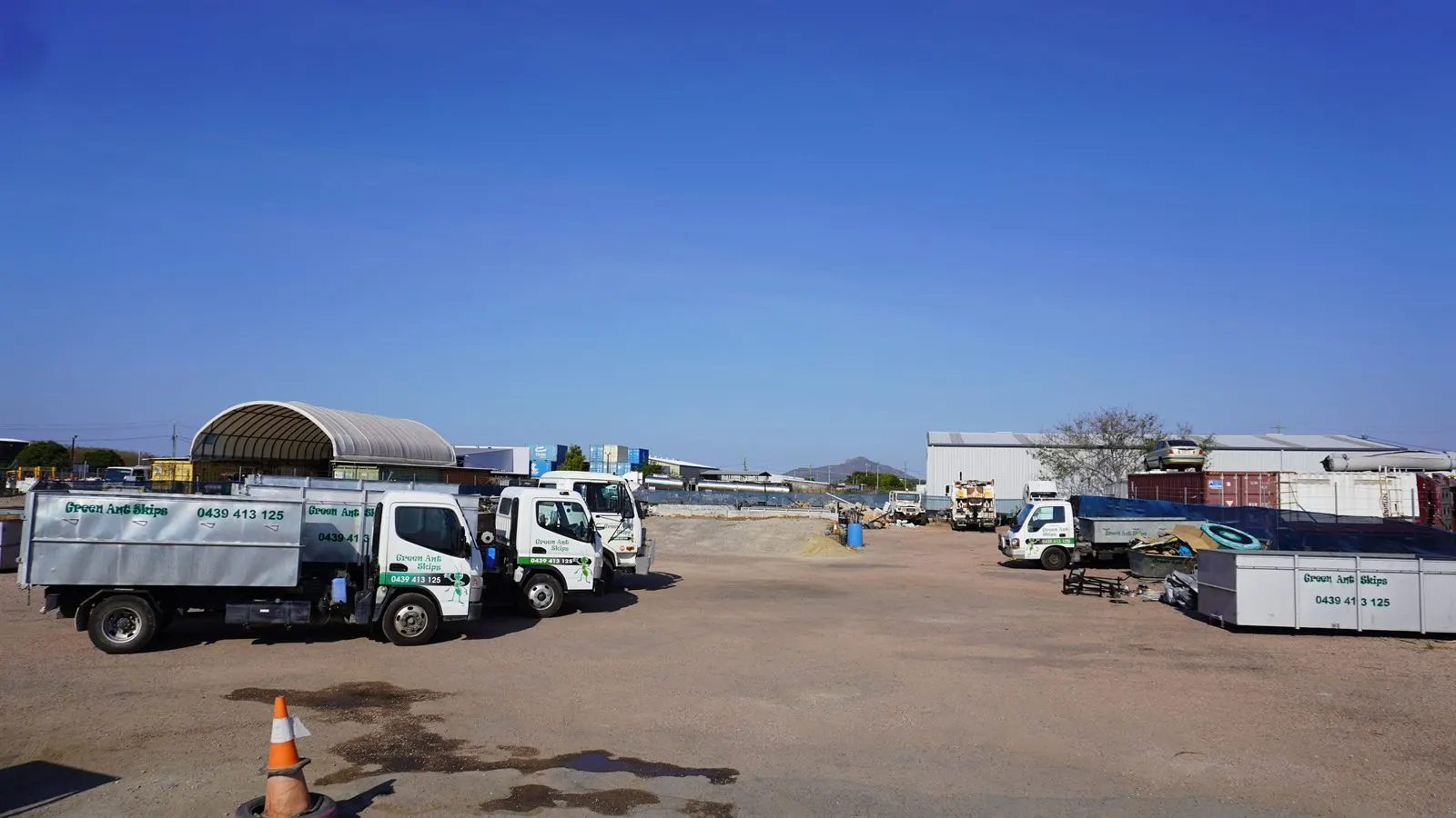 Green Ant Skips trucks and bins lined up at the Bohle yard, ready for rubbish removal Townsville-wide